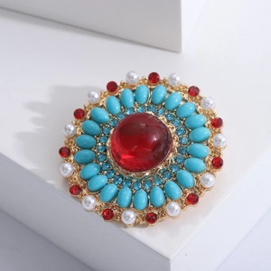 Baroque vintage brooch with red center ruby and pearl border in gold plating