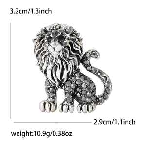 Detailed view of alloy lion brooch with grey rhinestones and size measurements
