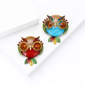 Fashionable owl brooches with enamel finish and crystal rhinestones in red and blue