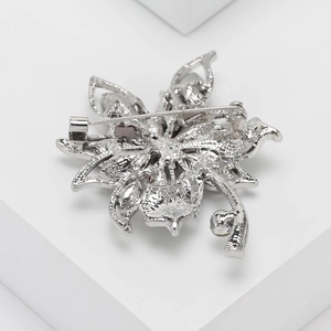 Detailed back view of silver floral brooch showing high-quality safety pin and hollowed casting
