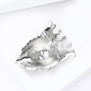 Silver lion head brooch back view with durable safety pin clasp for suits and coats