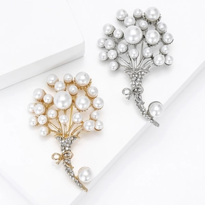 Eleganti spille bouquet di perle in oro e argento con dettaglio fiocco in cristallo