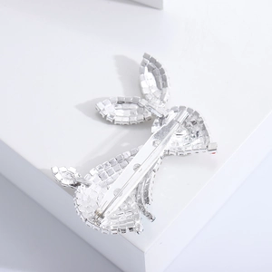 Detailed back view of the silver rabbit brooch showing the metal base and pin fastener