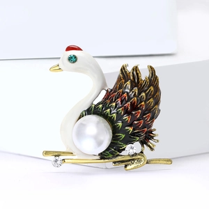 Elegant swan brooch with white enamel, gradient feathers, and a large central pearl detail