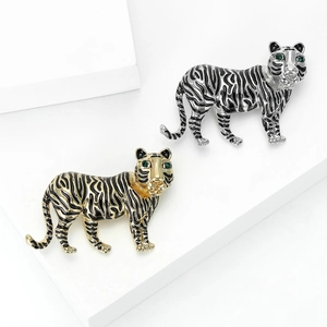 Vintage tiger brooch pin in gold and silver finish with green crystal eyes for suits