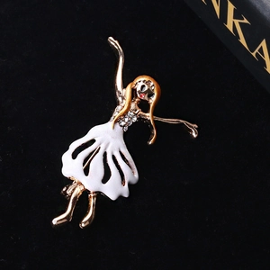 Detail of a ballet dancer brooch with white enamel skirt and sparkling cubic zirconia stones