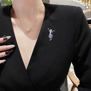 Elegant gold-plated ballet girl brooch with purple gradient skirt on black dress