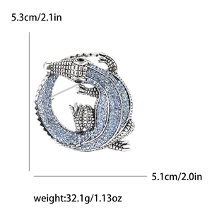Detail view of crystal crocodile brooch with 5.3cm by 5.1cm size and 32.1g weight display