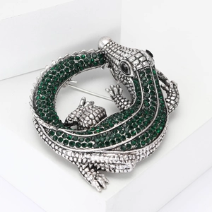 Vintage alligator brooch with green rhinestones on silver-toned alloy setting
