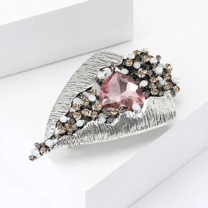 Vintage alloy brooch with pink triangle gemstone and rhinestones on white blocks