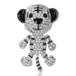 Cute cartoon tiger brooch with white rhinestones and black enamel detail on silver base