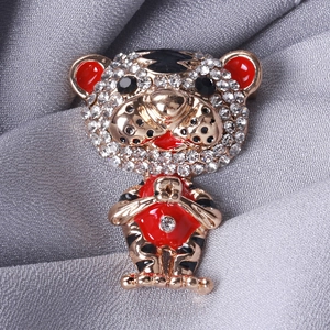 Cute cartoon tiger brooch in gold metal with sparkling rhinestones and red enamel details