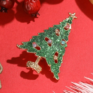 Broche sapin de Noël verte avec pierres précieuses colorées sur monture dorée