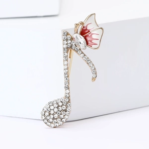 Broche élégante en note de musique dorée avec strass scintillants et papillon rouge