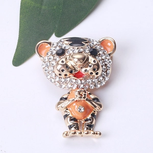 Detailed view of a cute tiger brooch with sparkling crystals and colorful enamel finish