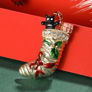 Vintage alloy Christmas stocking brooch with enamel bear and rhinestone details