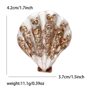 Detailed view of vintage shell brooch with enamel and rhinestones showing 4.2cm height scale