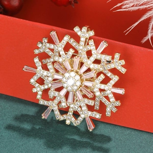 Exquisite close-up of a rotating snowflake brooch with gold plating and sparkling zircons