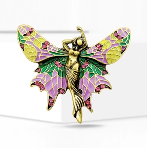 Detailed macro view of vintage angel brooch with purple enamel wings and pink rhinestones