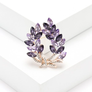 Elegant purple crystal olive branch brooch with gold plating and sparkling rhinestones