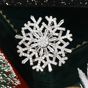 Exquisite close-up of double-layer rotating snowflake brooch with zircon on velvet box