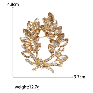 Elegante kristallen bauhinia krans broche met amberstenen en strik detail voor dames