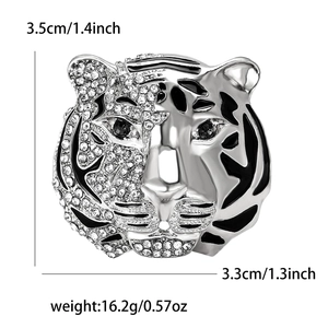 Detailed view of silver tiger head brooch with rhinestones and black enamel stripes