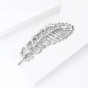Detailed back view of a silver leaf brooch showing the sturdy pin mechanism and metal texture