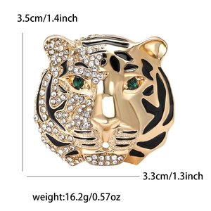 Vintage gold tiger head brooch with crystal rhinestones and green gemstone eyes for suits