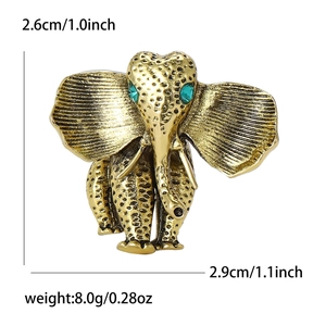 Retro elephant brooch in gold alloy with green gem eyes, size 2.6cm by 2.9cm