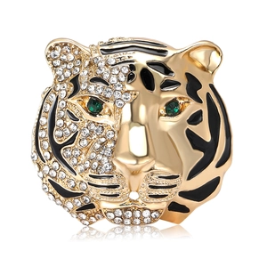 Vintage gold tiger head brooch with white rhinestones and green gem eyes for suits