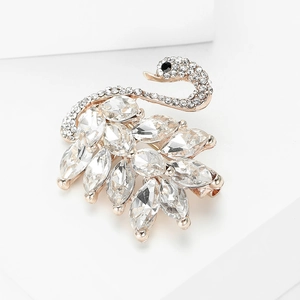 Detailed view of rose gold swan brooch featuring marquise-cut crystals and fine zircon pave