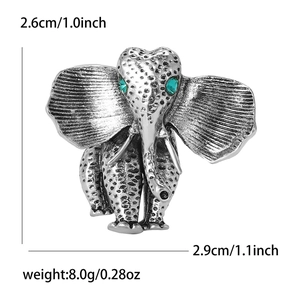 Retro elephant brooch in silver alloy with green gemstone eyes and detailed dimensions