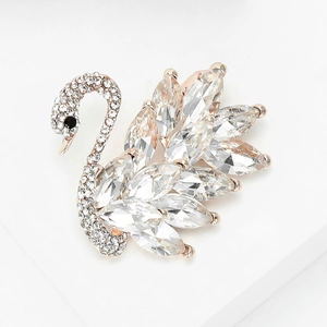 Macro shot of an elegant swan brooch with sparkling crystals and rose gold plating