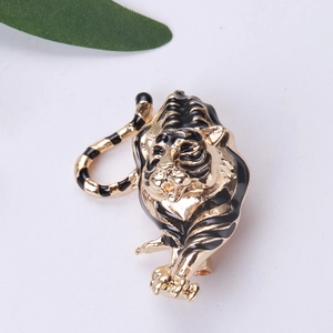 Detailed view of 3D tiger brooch in gold alloy with black enamel stripes and realistic details