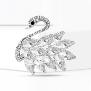 Macro shot of swan brooch showing detailed crystal wings and silver alloy finish