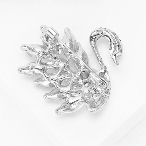 Macro detail of silver swan brooch back showing hollow craft and pin clasp