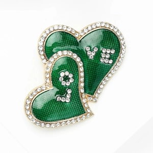 Close-up of green enamel double heart brooch with crystal rhinestones and LOVE lettering