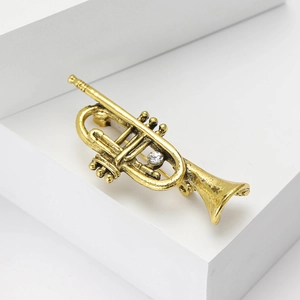 Vintage gold trumpet brooch pin for suits with crystal inlay on a geometric stone