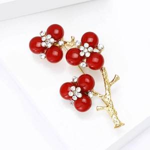 Chinese plum blossom branch brooch with red beads and sparkling white crystals
