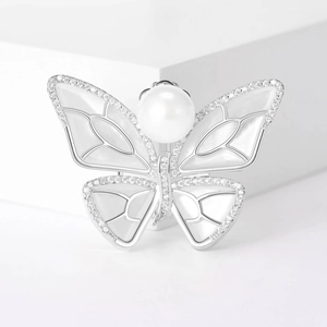 Elegant silver butterfly brooch with white pearl, shell inlay and shimmering zircons