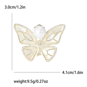 Elegant gold-plated butterfly brooch with white mother-of-pearl and crystal accents