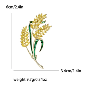 Golden wheat brooch with green enamel and yellow stones, size 6cm by 3.4cm