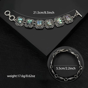 Vintage bohemian silver bracelet featuring iridescent abalone shell inlays and OT buckle