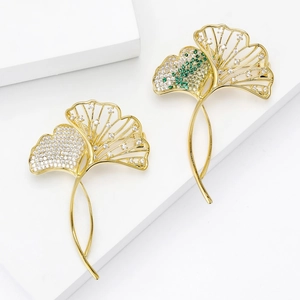 Elegant ginkgo leaf brooches with micro-pave white and green zircons on gold plating