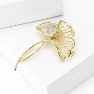 Detailed view of Ginkgo leaf brooch with zircon micro-paving and golden hollow structure
