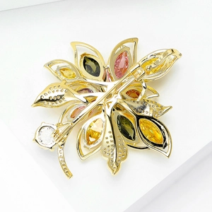 Back view of colorful zircon flower brooch in gold plating showing the pin lock