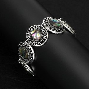 Vintage luxury alloy bracelet with ornate shell inlays and retro ethnic court style
