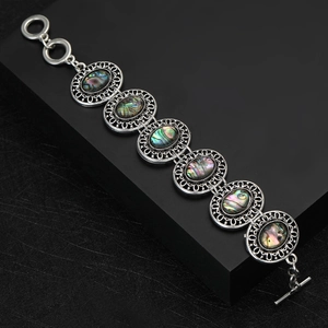 Vintage palace style bracelet with rainbow abalone shell in silver filigree settings