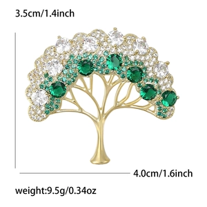 Broche arbre de vie dorée avec pierres émeraude et cristaux blancs de 4cm de large